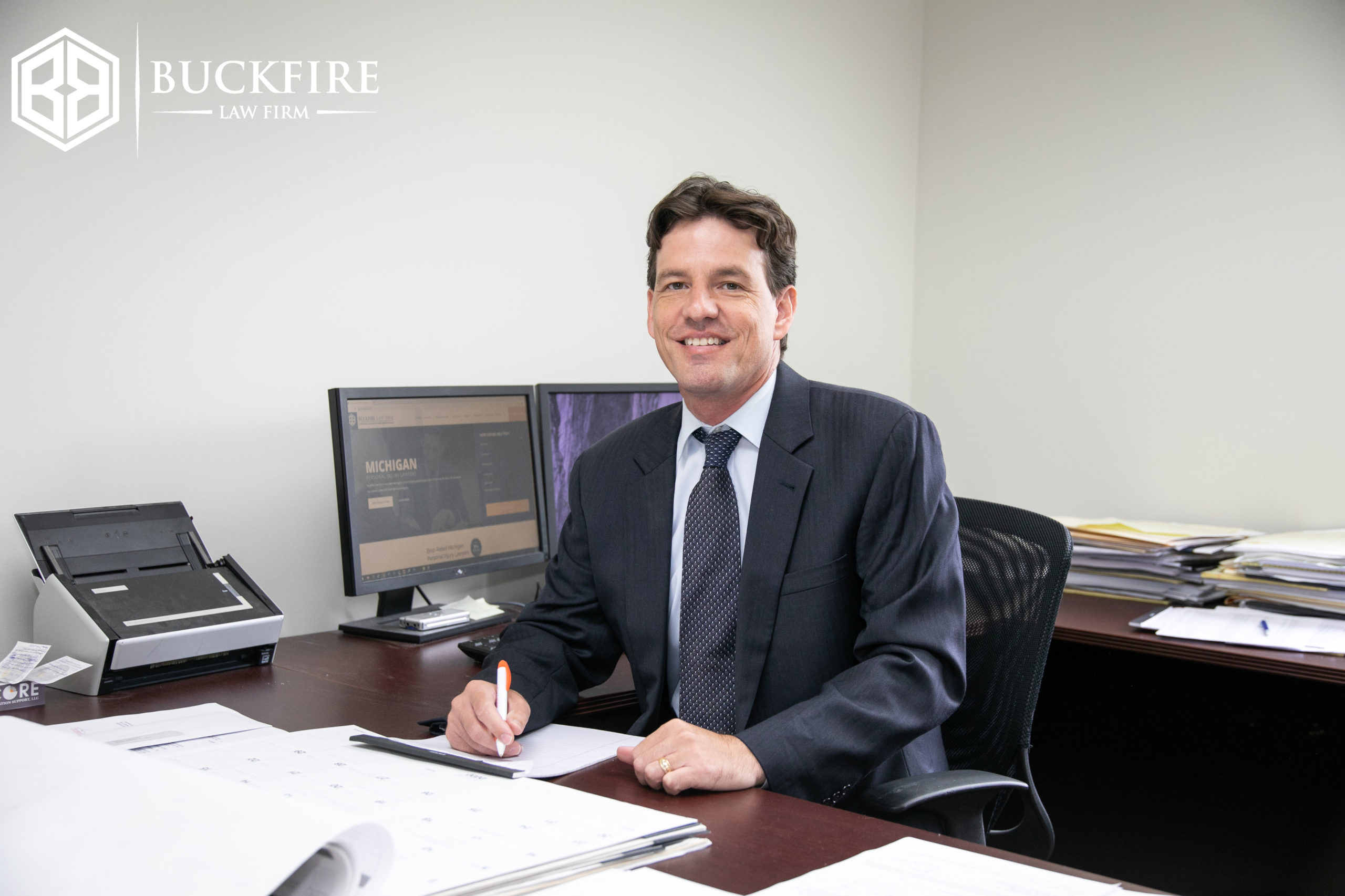 Attorney Dondi Vesprini sitting in his desk