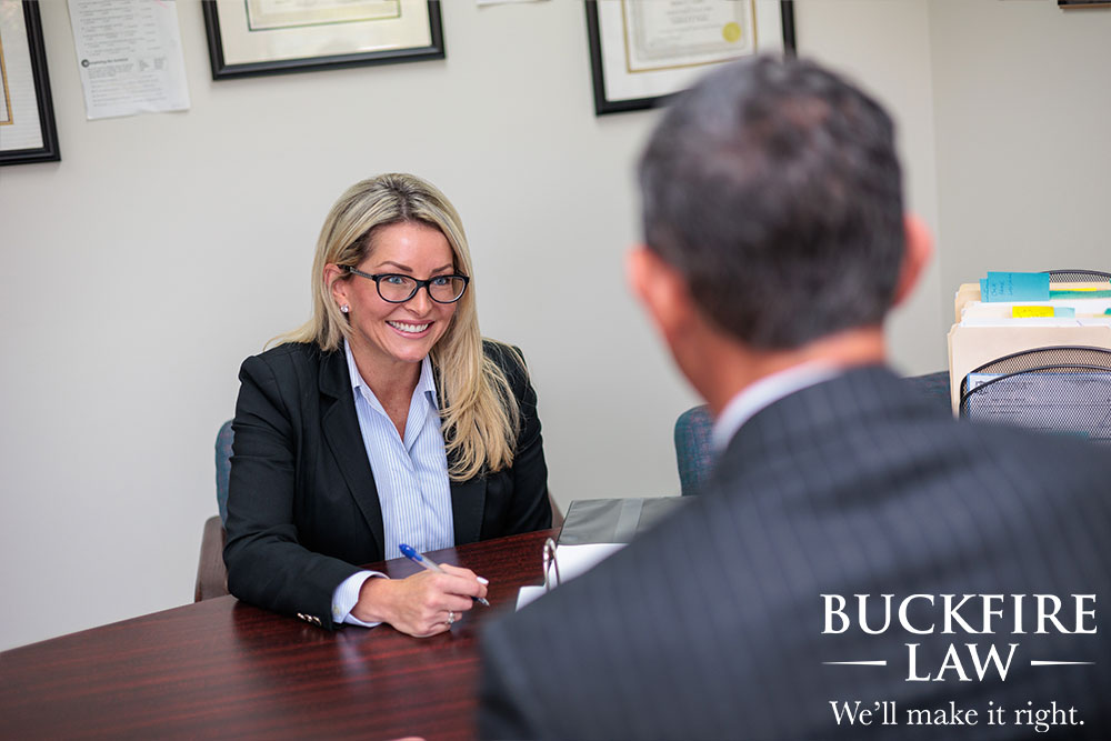 Detroit Slip and Fall Lawyers reviewing an injury file