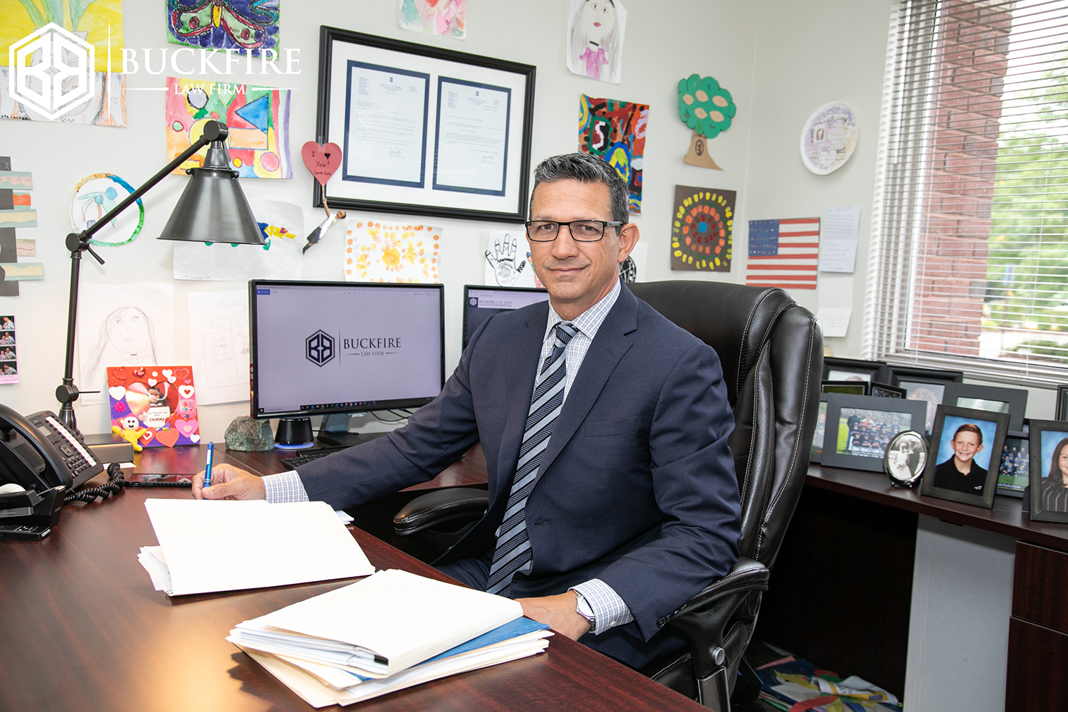 Michigan No Fault Insurance Attorney Sitting at Desk
